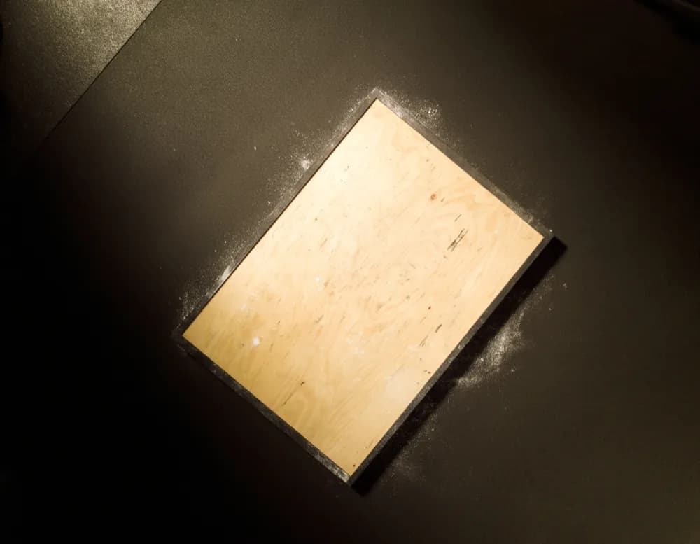 Empty competition platform of birch plywood with painted markings, seen from above
